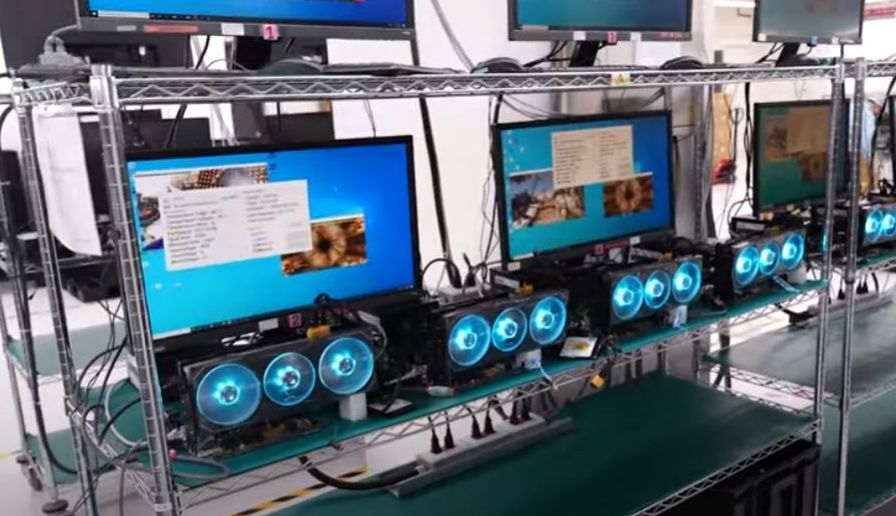 Custom PC builder verifying a new graphics card after assembly